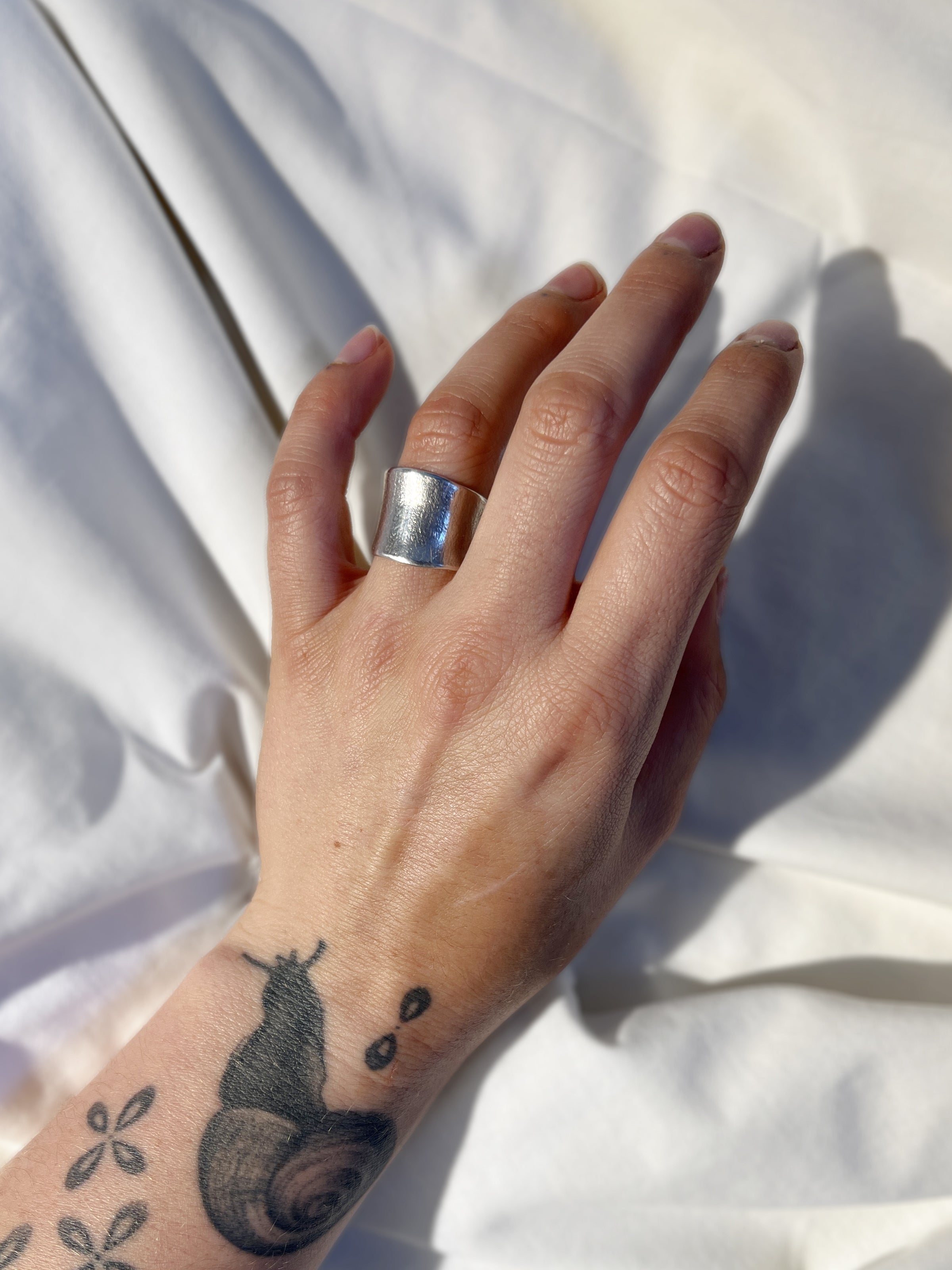 Wide flowing sterling silver ring