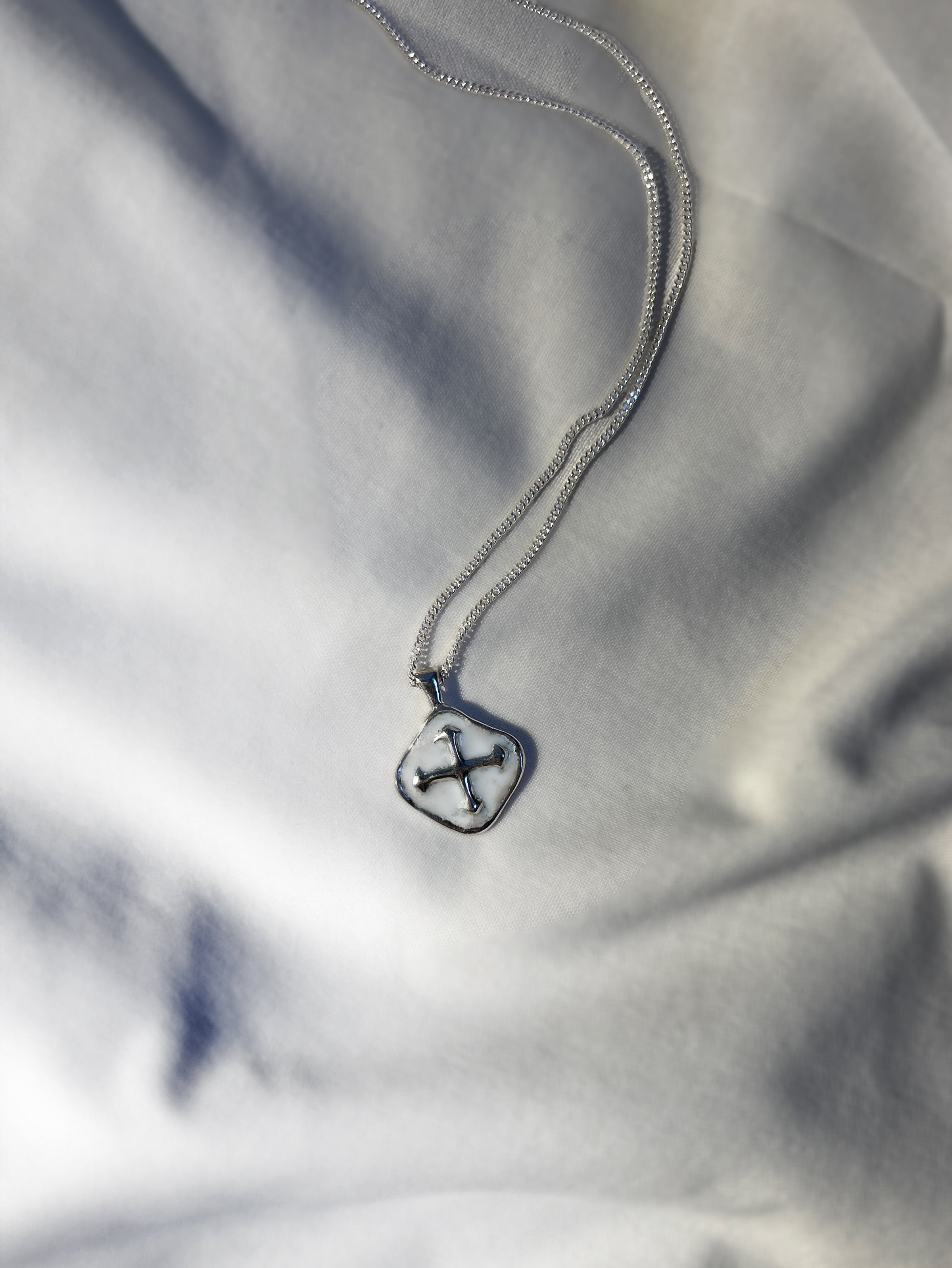 White enamelled sterling compass