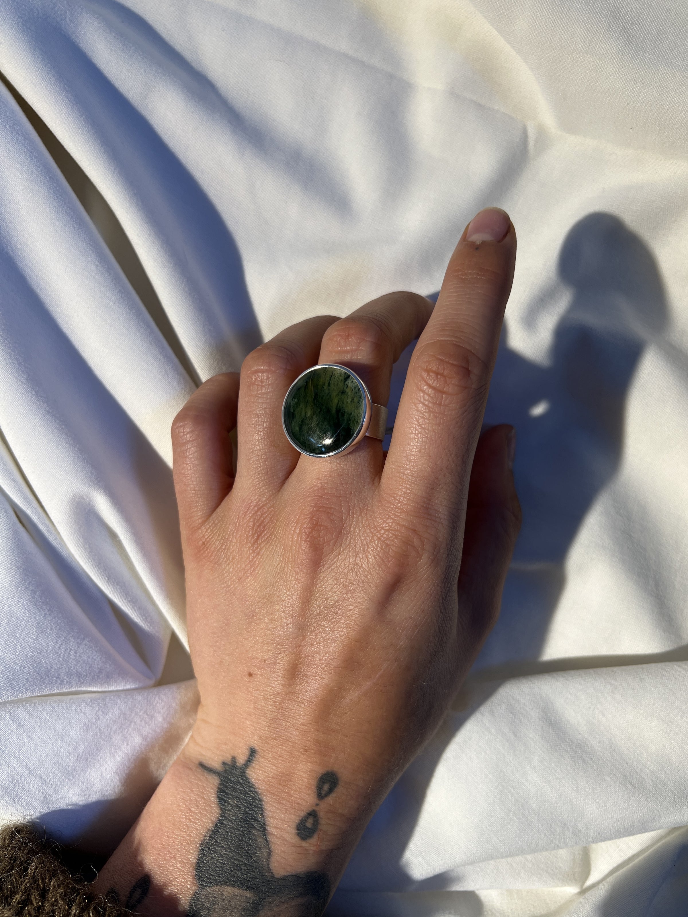Large Pounamu ring on flat silver shank