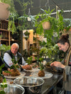 People working with plants in a workshop setting