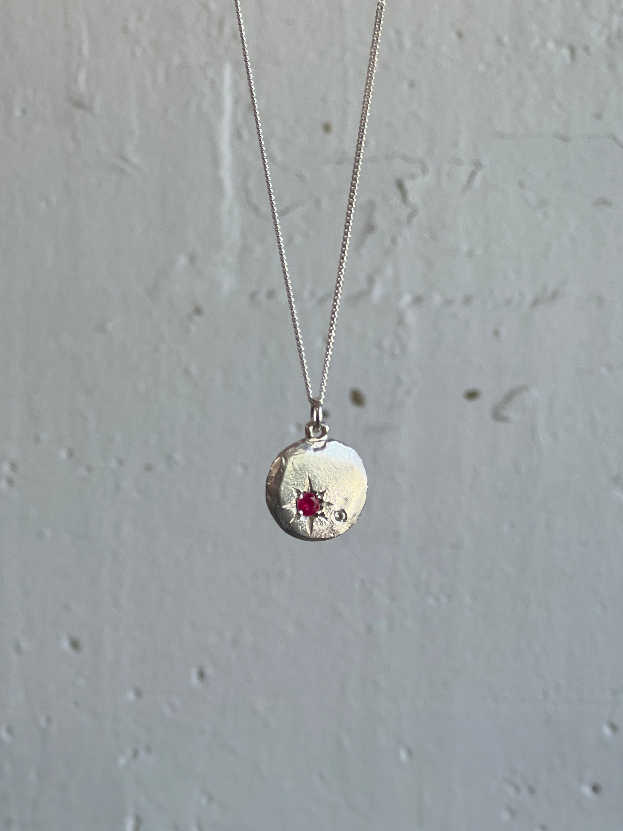 Lab grown dark red ruby and lab grown white sapphire honour pendant