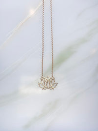Audrey loves Ruby lotus necklace