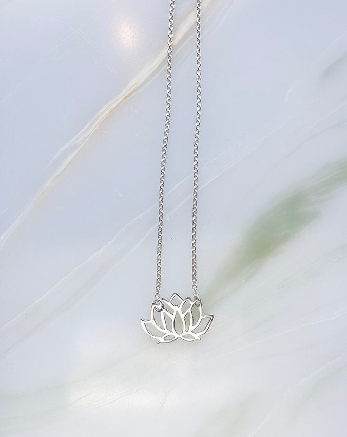 Audrey loves Ruby lotus necklace