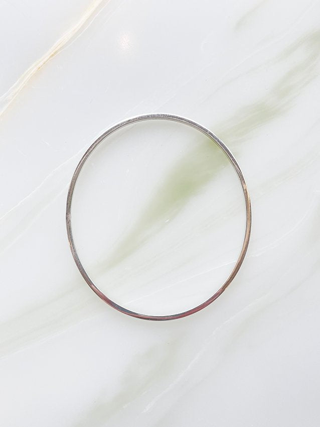 Audrey loves Ruby square wire bangle